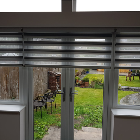 Grey day and night blinds door